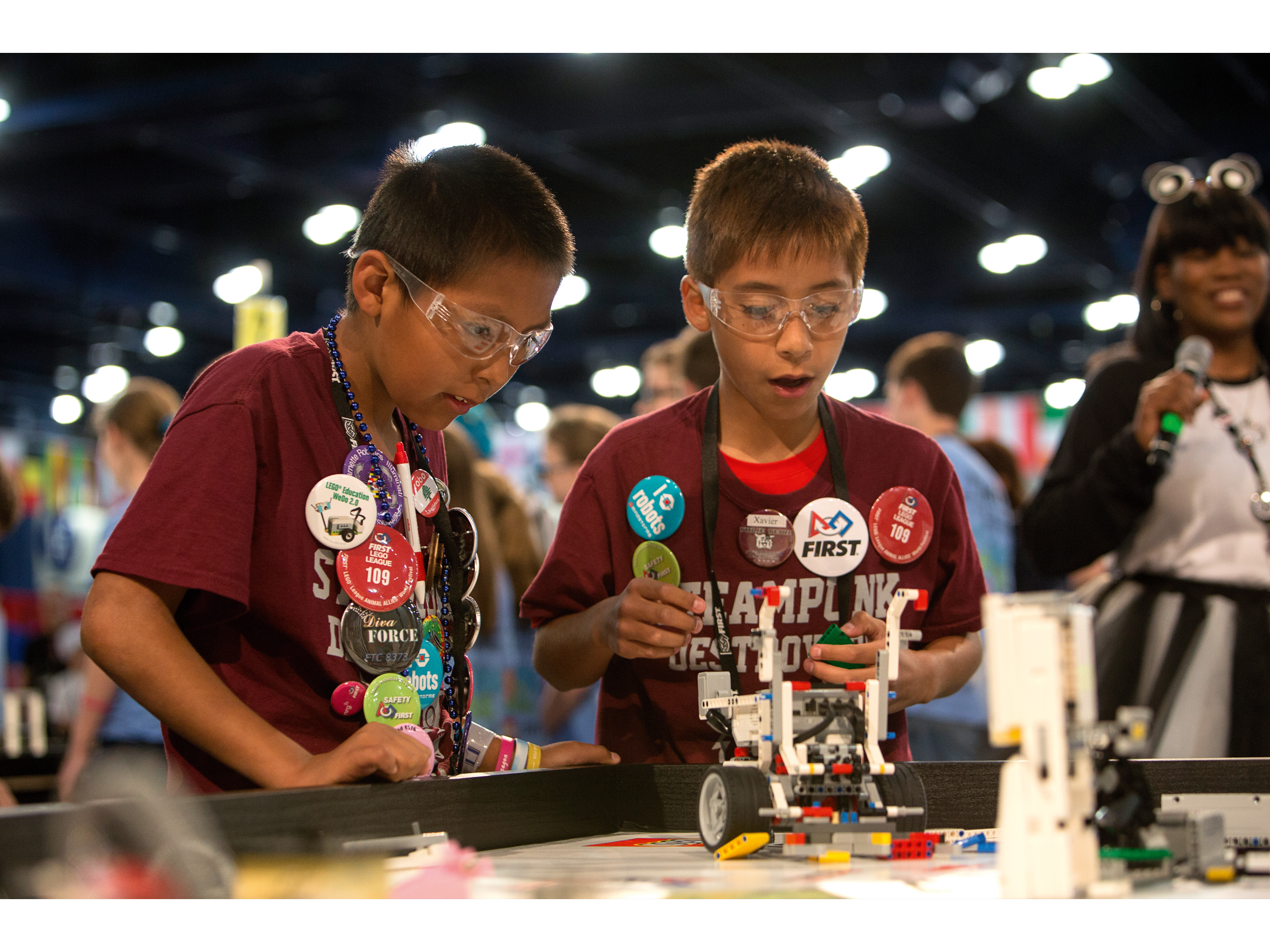 Students building a LEGO robot at FIRST LEGO League